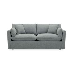 a gray couch sitting on top of a white floor