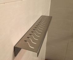 a metal grate mounted to the side of a wall