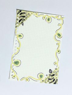 a notepad with an ornate design on it