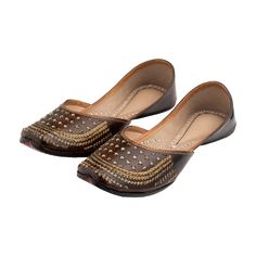 Introducing our "Sienna" Punjabi jutti, a graceful tribute to tradition and culture meticulously handcrafted by skilled artisans using pure leather. This exquisite footwear features a rich brown color adorned with unique gold jari work on the stylish upper, creating a captivating fusion of heritage and contemporary style. Every stitch of the "Sienna" jutti is infused with the rich legacy of Punjabi craftsmanship, ensuring impeccable quality and attention to detail. Its simple yet sweet design serves as a reminder of the roots of tradition and culture, connecting you with the timeless charm of Punjab's artistic heritage. Wearing the "Sienna" jutti, you'll feel a deep sense of connection to your cultural identity, as it symbolizes your reverence for tradition and your appreciation for the fi Jutti Punjabi, Punjabi Jutti, Traditional Attire, Shoe Gifts, Traditional Indian, Handcrafted Leather, Brown Color, Women's Shoes Sandals, Leather Shoes