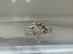 10kt white and yellow gold ring set with a .03ct diamond! Weighs 1.6dwt, is 10mm at its widest point and is currently a size 6.75 but can be resized! Heart Engagement Ring, Heart Engagement, Vintage Jewellery Rings, Heart Engagement Rings, Diamond Heart Ring, Gold Ring Sets, Yellow Gold Ring, Diamond Heart, Yellow Gold Rings