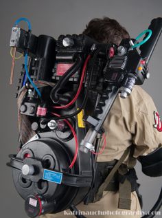 the back of a fireman's head with multiple wires attached to his body