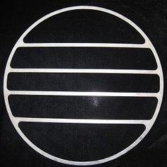 an image of a round metal object on a black background