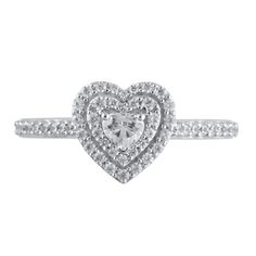 Steal her heart with the romantic details of this charming diamond engagement ring. Crafted in cool 10K white gold, this look showcases a 1/6 ct. heart-shaped diamond sparkling in a double diamond-lined frame. The shank shimmers with diamonds while hidden bezel-set diamonds adorn the gallery. Captivating with 1/2 ct. t.w. of diamonds and a bright polished shine, this engagement ring suits her sweet style. White Heart Ring With Diamond Accents, Heart Shaped Engagement Rings, Double Frame, Double Diamond, Bezel Set Diamond, Loose Stones, Heart Shaped Diamond, Sweet Style, Diamond Heart