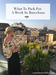 a woman standing on top of a roof pointing to the sky with text overlay that reads, what to pack for a week in barcelona