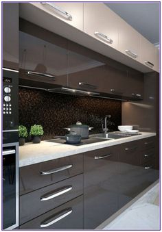 a modern kitchen with stainless steel appliances and dark wood cabinetry, along with white countertops