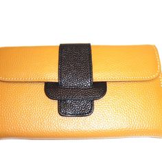 Hampton Gems-Two Tone Leather Wallet/Clutch. Very Soft Leather. Use This As A Clutch Or A Wallet To Put In A Bag. It Can Fit A Cell Phone. I Love It !!!! Ships In A Box, So Its A Perfect Gift. Perfect Summer Accessory. Available: Orange/Blue, Grey/Yellow, Black/Orange, Tan/Black Bag Depth: 1″ Inches Bag Length: 8″ Inches Bag Height: 4.5″ Inches Yellow Wallet With Removable Pouch For Daily Use, Yellow Leather Travel Wallets, Orange Pouch Wallet For Everyday Use, Orange Pouch Wallet For Daily Use, Yellow Leather Wallet For Everyday Use, Orange Leather Wallet For Daily Use, Yellow Leather Clutch For Everyday Use, Orange Leather Wallets With Interior Card Slots, Orange Leather Wallet With Card Slots