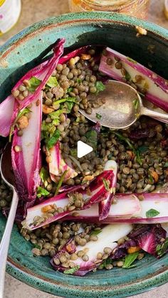 a green bowl filled with lentils and radishes