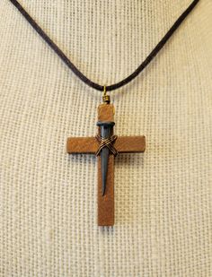 Handmade wire wrapped wooden cross with real nail on an comfortable nylon sliding knot cord.   Can be worn long, regular length, or as a choker.  Available with bronze wire and brown cord, or silver wire with black cord.  Shipping is included in the price. Wire Wrapped Cross, Wire Crosses, Wood Animal, Box Guitar, Doll Jewelry, Handmade Wire Wrapped, Wooden Cross, Sliding Knot, Handmade Wire