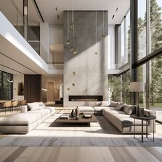 a large living room with high ceilings and floor to ceiling windows on both sides of the wall