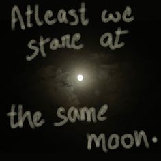 the moon is lit up in the dark sky with words written on it that read, at least we stare at the same moon