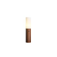 a wooden lamp with a white light on it's side and a brown base