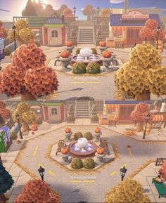 an animated city with lots of trees and pumpkins on the ground in front of buildings