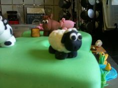 there is a cake decorated to look like farm animals