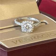 a diamond engagement ring sitting on top of a box with the words verragio written on it