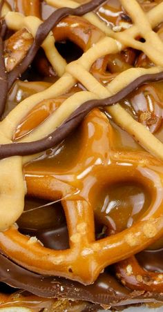 an assortment of pretzels with chocolate and caramel drizzled on them