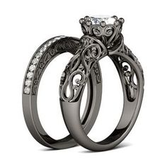 two wedding rings with an intricate design on the side and diamond set in the middle