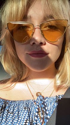 a close up of a person wearing sunglasses