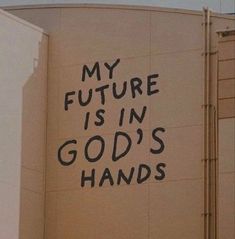 graffiti on the side of a building that says, my future is in god's hands