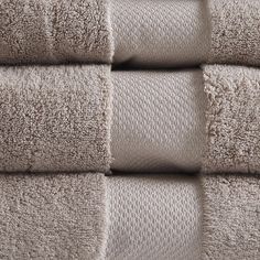 four folded towels stacked on top of each other