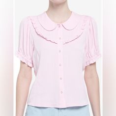 Your Outfit Will Be In Full Bloom With This Adorable Woven Button-Up! Add Something As Sweet As Cherry Blossoms To Your Wardrobe With This Pink Top, Featuring Sakura Buttons Down The Center, A Peter Pan Collar And Bib Detailing Along The Chest. Comes With Puffy Elasticated Sleeves And Princess Seams. 100% Rayon Wash Cold; Dry Low 22" Length Non Stretch Pink Collared Top With Button Closure, Feminine Pink Collared Top, Feminine Tops With Peter Pan Collar And Button Closure, Summer Tops With Peter Pan Collar And Button Closure, Feminine Collared Blouse With Buttons, Feminine Short Sleeve Shirt With Buttons, Feminine Blouse With Collared Neckline And Buttons, Cute Collared Blouse With Button Closure, Feminine Collared Tops With Buttons