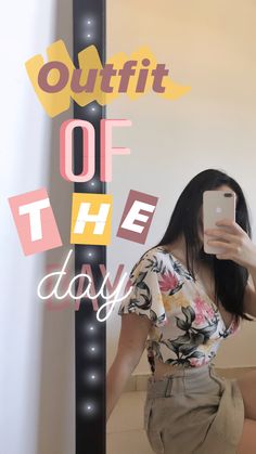 a woman taking a selfie in front of a sign that says outfit of the day