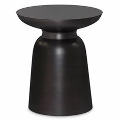 a black table with a round top on it's legs and an oval base