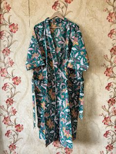 Step into a world of timeless elegance with our "Exquisite Blossoms" Floral Print Kimono. Delicately crafted to infuse your style with a touch of nature's beauty, this kimono is a stunning addition to any wardrobe. 🌸 Luxurious Comfort: Made from high-quality, lightweight fabric, this kimono ensures a luxuriously soft and silky feel against your skin. The relaxed, flowy fit allows for effortless movement, while the three-quarter sleeves add a touch of sophistication to your ensemble. 🌸 One Size Bridesmaid Kimono, Kimono Floral, Floral Print Kimono, Cotton Kimono, Floral Kimono, Womens Robes, Dressing Gown, Three Quarter Sleeves, Halloween Shopping