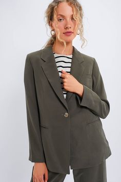 A polished layer with chic detailsFeaturing a chic self-tie waist and lapel collar in a neutral hue, the Shea Blazer is perfect for everything from the office to date night. Finished with shoulder pads and a single button closure, pair it with the matching Khaki Erin Pants for a power suit moment, wear to work with the button done & then use the self belt and leave it open a little bit for drinks.Our Favorite Details: Shoulder pads One button closure Removable self tie waist belt (included) Fron Power Suit, Wear To Work, Kids Sale, Lapel Collar, Waist Belt, Shoulder Pads, The Office, To Work, Date Night