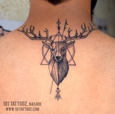 a man with a deer head tattoo on his back