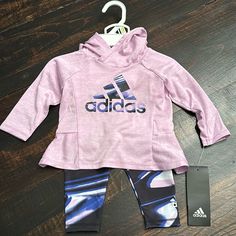 New With Tags! Adidas Baby Girl 2-Piece Set. Sporty & Stylish. Longsleeve Hooded Top With Leggings. Adidas Logos On Front Of Shirt And Left Ankle. Colors - Light Purple, Navy Blue, Black And White. 100% Polyester. Sporty Long Sleeve Playtime Sets, Purple Cotton Playwear Sets, Stretch Long Sleeve Playtime Set, Stretch Long Sleeve Sets For Playtime, Spring Stretch Purple Sets, Spring Purple Stretch Sets, Purple Fitted Sets For Playwear, Purple Long Sleeve Sets For Winter, Adidas Pink Playwear Sets