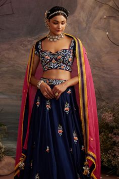 Navy blue lehenga with floral embroidery and lace detailing border. Comes with embroidered blouse and pink dupatta.
Component: 3
Pattern: Embroidery
Type Of Work: Thread, Beads and Sequin
Neckline: Sweetheart
Sleeve Type: Cap
Fabric: Dupion Silk and Organza
Color: Blue
Other Details: 
Dupatta with contrast border and tassels
Low back with tie up
Occasion: Wedding - Aza Fashions Anarkali Lehenga With Floral Embroidery, Blue Anarkali Set With Floral Embroidery For Wedding, Blue Choli With Intricate Embroidery, Blue Floral Embroidery Anarkali Set For Wedding, Fitted Blue Sharara With Floral Embroidery, Blue Floral Embroidered Semi-stitched Choli, Blue Embroidered Lehenga In Georgette, Blue Georgette Lehenga With Intricate Embroidery, Blue Embroidered Georgette Lehenga