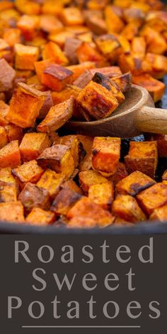 roasted sweet potatoes in a pan with a wooden spoon on the side and text overlay reading roasted sweet potatoes