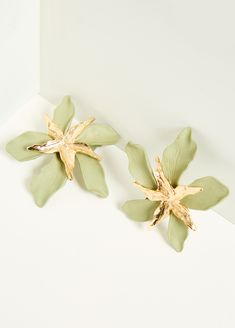 Textured petals are beautifully realistic as they're illuminated by gilded accents on our clip-on earrings. Gold Clip-on Earrings For Spring Party, Spring Party Gold Clip-on Earrings, Gold Flower Clip-on Earrings For Spring, Gold Petal Earrings For Party, Flower Clip, Ashley Stewart, Accessories Jewelry Earrings, Gold Floral, Gold Texture