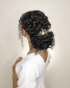 the back of a woman's head with curly hair