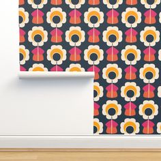 a wallpaper with an abstract flower pattern on it, next to a wooden floor