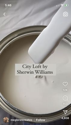 a white paint can being painted with the words city loft by sherylin williams