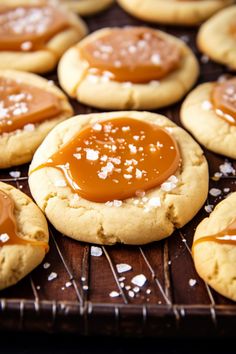 peanut butter and jelly cookies on a cooling rack with sea salt sprinkled on top