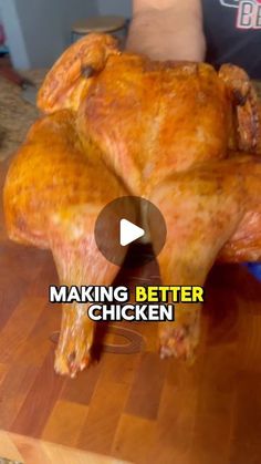 a chicken sitting on top of a wooden cutting board with the words making better chicken