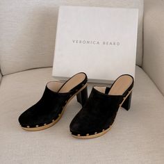 Gorgeous Veronica Beard Platform Clogs. Grita Clog In Black Suede Leather. Leather Lined. Gold Accent Rivets. Almond Toe. These Are Truly Beautiful And Look Fantastic With Flares Or Bootcut Jeans!! New With All Packaging And Dust Bag. Chic Slip-on Clogs With Reinforced Heel, Chic Suede Clogs With Stacked Heel, Chic Suede Clogs With Wooden Heel, Chic Clogs With Platform And Almond Toe, Chic Platform Clogs With Almond Toe, Chic Clogs With Open Heel In Medium Width, Chic Open Heel Clogs Medium Width, Chic Almond Toe Platform Clogs, Chic Clogs With Rubber Sole And Round Toe