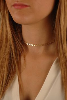 "All the trend!! This very popular tattoo choker is now available in genuine Gold-Filled, Sterling Silver, or Rose Gold-Filled. This choker is made of the highest quality materials. About the Flat Disc Necklace: - 14K Gold-Filled (shown in photo), or Sterling Silver, or 14K Rose Gold-Filled - Your choice of adjustable length from 13\" - 16\" (The very petite model in first photo is wearing about a 13\" chain) - discs measure about 4mm wide - Beautifully Gift Boxed - Made in the USA - parts and a Dainty 14k Gold Filled Choker, Dainty Handmade Gold Choker, Gold Coin Choker Necklace As Gift, Gold Coin Choker Necklace Gift, Gold Coin Choker Necklace For Gift, Dainty Gold Round Choker, Delicate Handmade Gold Choker, Gold Coin Choker, Tattoo Necklace