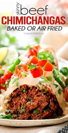 a plate filled with beef and vegetables covered in sauces, garnished with cilantro