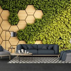 a living room with couches, chairs and a wall covered in green ivy leaves