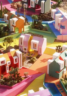 an aerial view of colorful houses in the desert