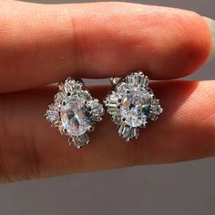 Details .Pair If Earrings . 925 / 18kt White Gold .Stone: Zirconia .Carats: 2.00 Formal Cubic Zirconia Clip-on Earrings, Diamond White Cluster Earrings In Cubic Zirconia, Dazzling Cubic Zirconia Crystal Earrings With Halo Design, Fine Jewelry Crystal Earrings With Diamond Accents For Anniversary, Elegant Silver Oval Clip-on Earrings, Elegant Oval Silver Clip-on Earrings, Classic Diamond Clip-on Earrings, White Gold Clip-on Earrings For Anniversary, Fine Jewelry Crystal Earrings With Diamond Cut