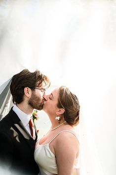 Church Wedding in the United Kingdom with DIY Details - Autumn Weddings - Elopements - bride and groom kissing under wedding veil