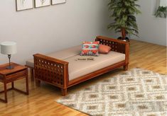 a wooden bed sitting on top of a hard wood floor