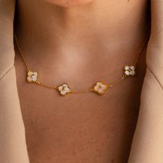 Our enchanting Pearl Clover Letter Necklace features a delicate four-leaf clover adorned with lustrous pearls, symbolizing love, luck, and elegance. Personalize it with your chosen initial or name, creating a timeless keepsake that speaks to the heart. Perfect for celebrating love or marking a special moment, this necklace is a luxurious expression of affection and devotion. SKU: RR-NM164F33 Product Details Material: High Quality Solid 925 Sterling Silver Finish: 18K Gold ∙ Sterling Silver ∙ Ros Luxury White Necklace With Flower Charm, Elegant Tarnish Resistant Flower-shaped Necklaces, Elegant Tarnish-resistant Flower-shaped Necklace, Letters Necklace, Striking Beauty, Clover Design, Diamond Huggies, Initial Gifts, Dainty Studs