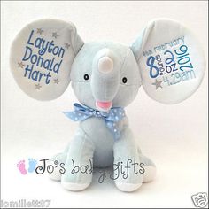 an elephant stuffed animal with two buttons on it's ears that say laugh, don't hurt