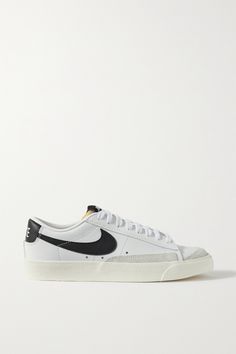 Modeled after archival styles, Nike updates its 'Blazer Low '77 SE' sneakers with gray suede trims. They're made from supple white leather and detailed with a black 'Swoosh', topstitching and the label's printed moniker. Nike Blazer Mid 77 Low, Low Top Nike Blazers, Nike 77 Blazer, Low Top Blazers, Nike Blazers Low, 90s Kate Moss, Nike 77, Nike Blazer Black, Low Top Nikes